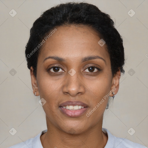 Joyful black young-adult female with short  black hair and brown eyes