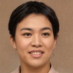 Joyful asian young-adult female with medium  brown hair and brown eyes