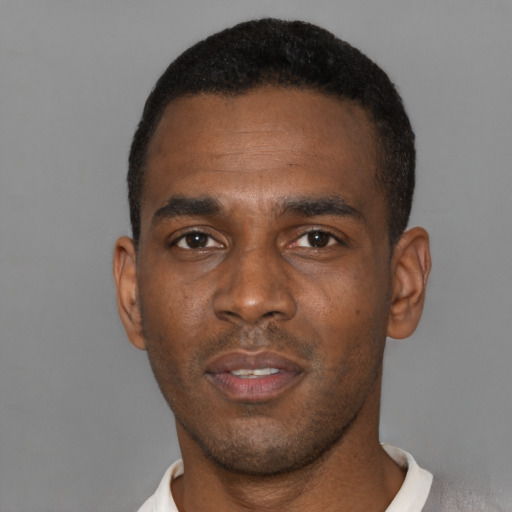 Neutral black young-adult male with short  black hair and brown eyes