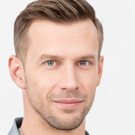 Joyful white adult male with short  brown hair and grey eyes