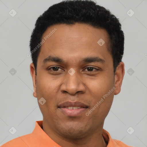 Joyful latino young-adult male with short  black hair and brown eyes