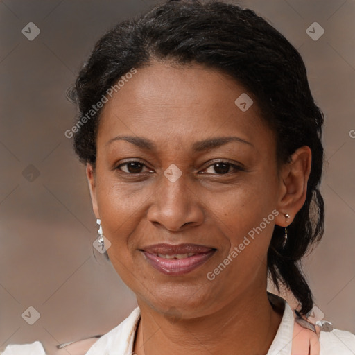 Joyful latino adult female with short  brown hair and brown eyes