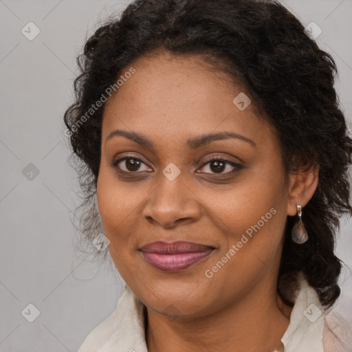 Joyful black adult female with medium  brown hair and brown eyes