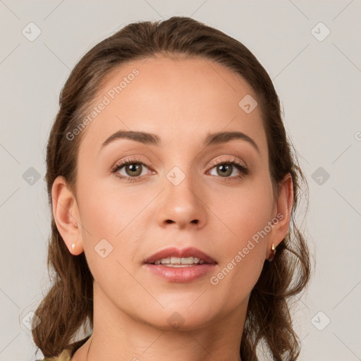 Joyful white young-adult female with medium  brown hair and grey eyes