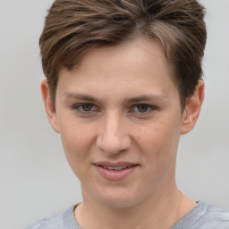 Joyful white young-adult female with short  brown hair and grey eyes