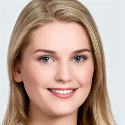 Joyful white young-adult female with long  brown hair and blue eyes