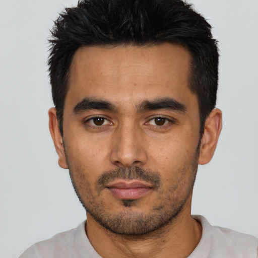 Neutral latino young-adult male with short  black hair and brown eyes