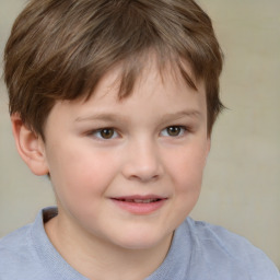 Joyful white child male with short  brown hair and brown eyes