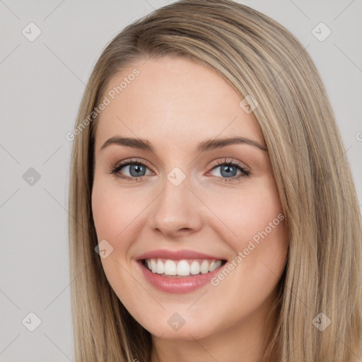 Joyful white young-adult female with long  brown hair and blue eyes