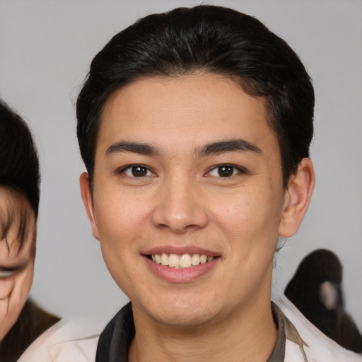 Joyful white young-adult male with medium  brown hair and brown eyes