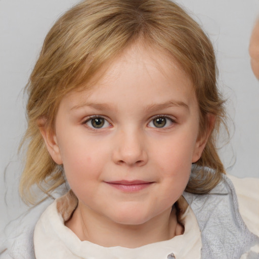 Joyful white child female with medium  brown hair and blue eyes