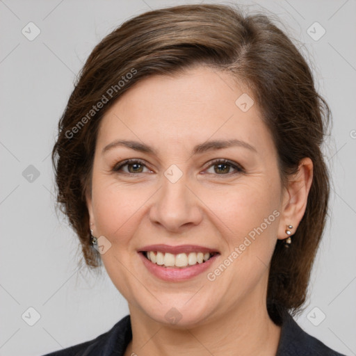 Joyful white adult female with medium  brown hair and brown eyes