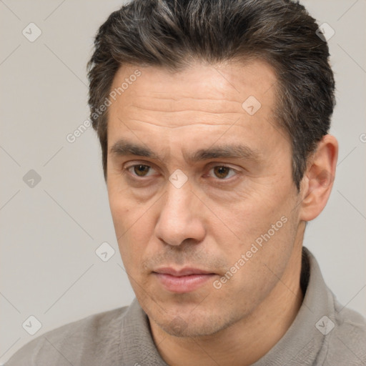 Neutral white adult male with short  brown hair and brown eyes