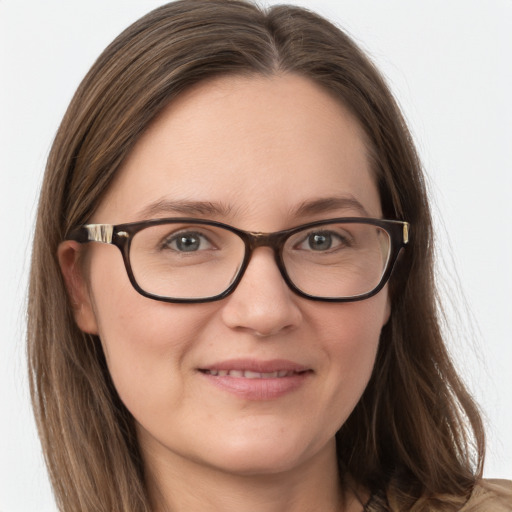 Joyful white adult female with long  brown hair and brown eyes