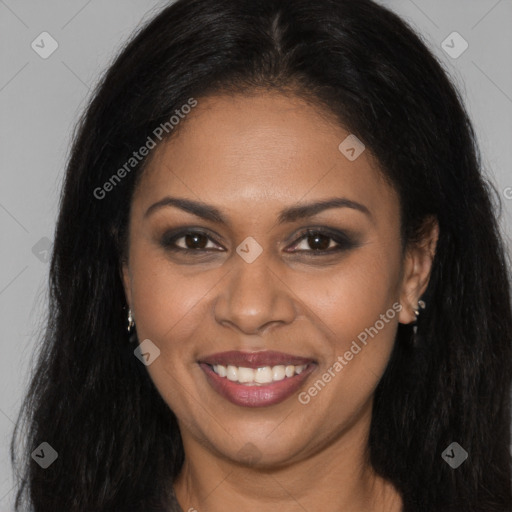 Joyful black young-adult female with long  brown hair and brown eyes