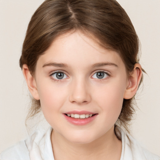 Joyful white child female with medium  brown hair and grey eyes