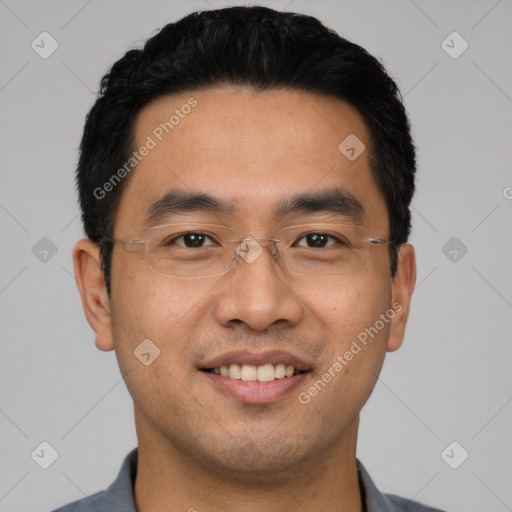 Joyful latino young-adult male with short  black hair and brown eyes