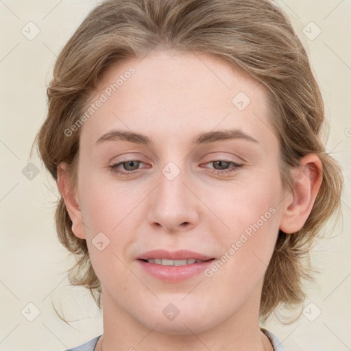 Joyful white young-adult female with medium  brown hair and blue eyes