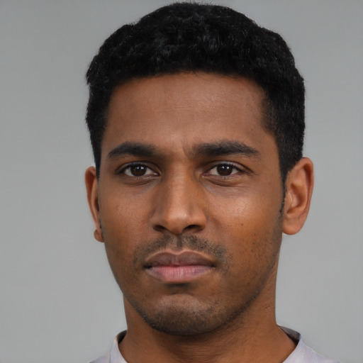 Neutral latino young-adult male with short  black hair and brown eyes