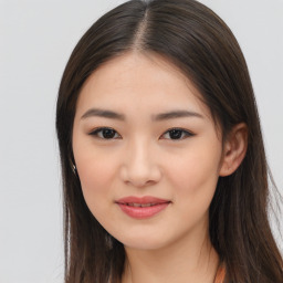 Joyful asian young-adult female with long  brown hair and brown eyes