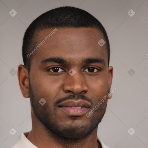 Joyful black young-adult male with short  brown hair and brown eyes