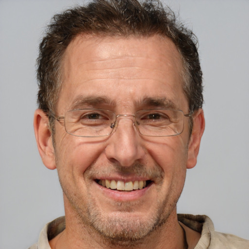 Joyful white middle-aged male with short  brown hair and brown eyes