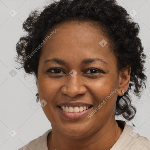 Joyful black adult female with short  brown hair and brown eyes