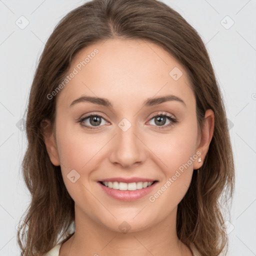 Joyful white young-adult female with long  brown hair and green eyes