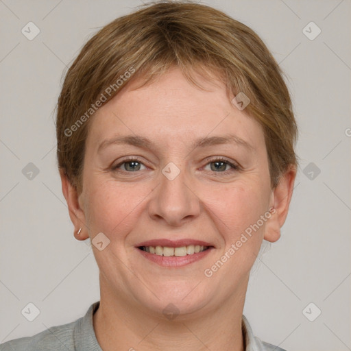 Joyful white adult female with short  brown hair and grey eyes