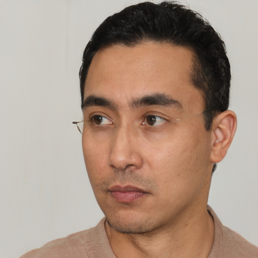 Neutral white young-adult male with short  black hair and brown eyes