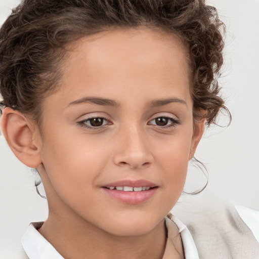 Joyful white child female with short  brown hair and brown eyes