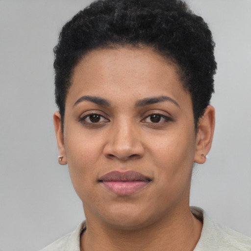 Joyful latino young-adult female with short  black hair and brown eyes