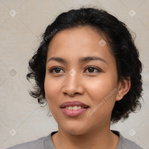 Joyful latino young-adult female with medium  black hair and brown eyes