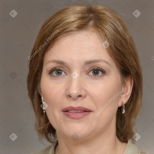 Joyful white adult female with medium  brown hair and brown eyes