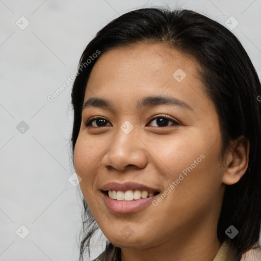 Joyful asian young-adult female with medium  brown hair and brown eyes