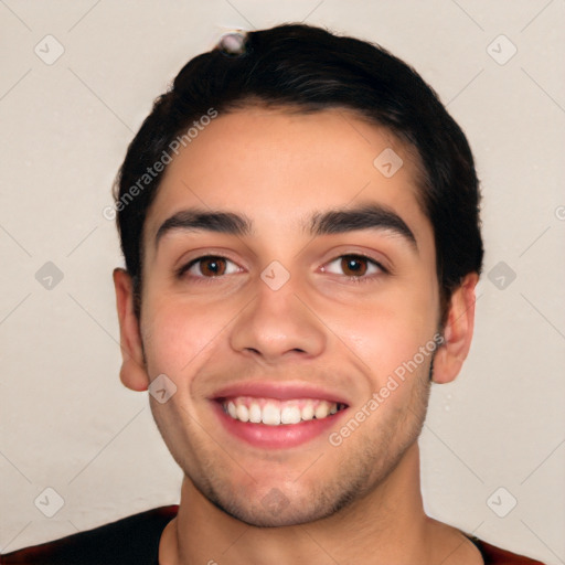 Joyful white young-adult male with short  black hair and brown eyes