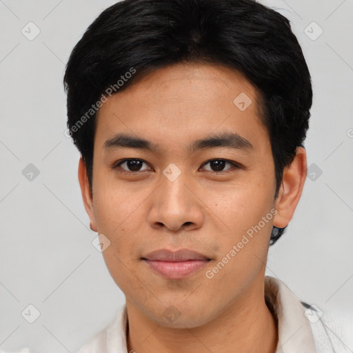 Joyful asian young-adult male with short  black hair and brown eyes