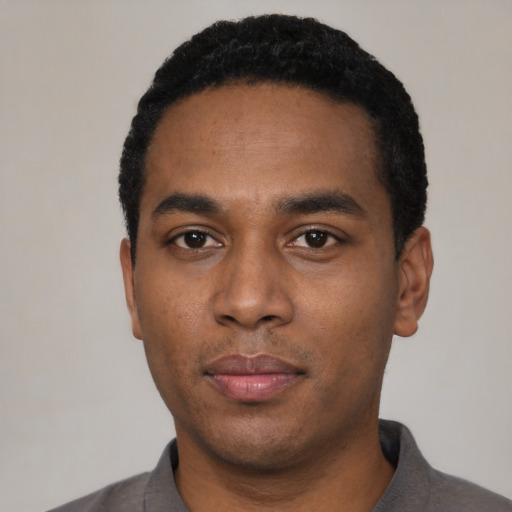 Neutral black young-adult male with short  black hair and brown eyes