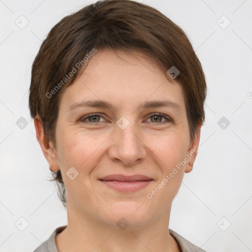 Joyful white young-adult female with short  brown hair and grey eyes