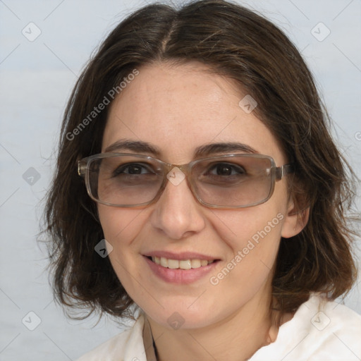 Joyful white adult female with medium  brown hair and brown eyes