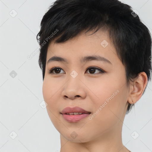 Joyful asian young-adult female with short  brown hair and brown eyes