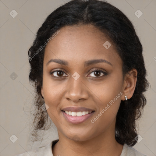 Joyful black young-adult female with medium  brown hair and brown eyes