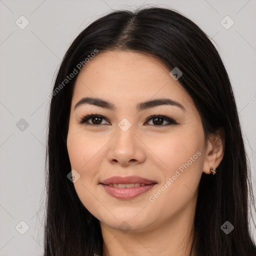 Joyful white young-adult female with long  black hair and brown eyes