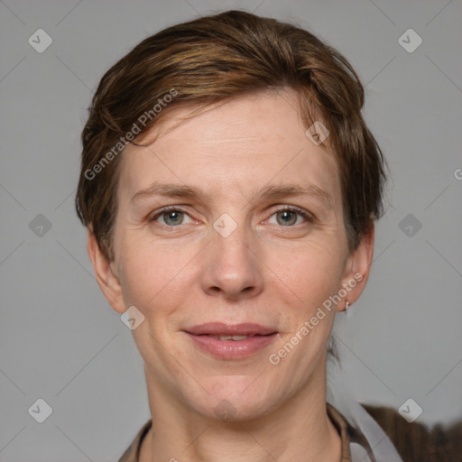 Joyful white adult female with short  brown hair and grey eyes