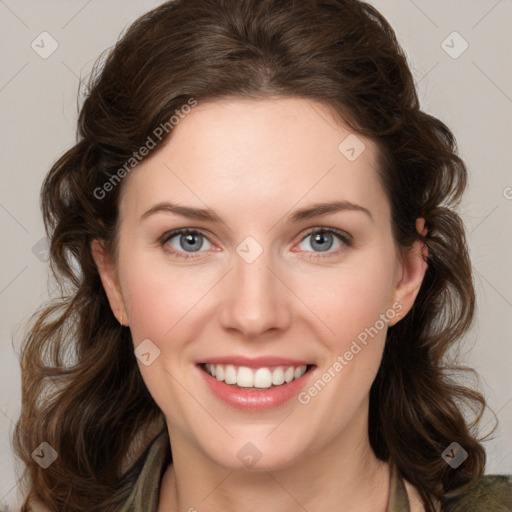 Joyful white young-adult female with medium  brown hair and green eyes