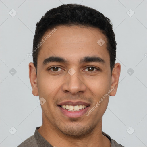 Joyful latino young-adult male with short  black hair and brown eyes
