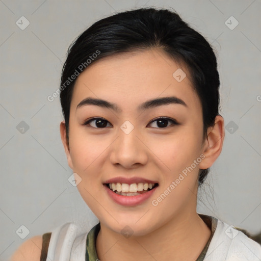 Joyful asian young-adult female with medium  black hair and brown eyes