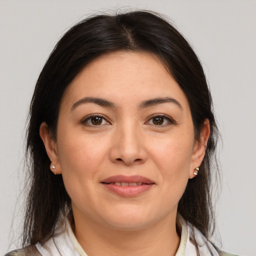 Joyful white young-adult female with medium  brown hair and brown eyes