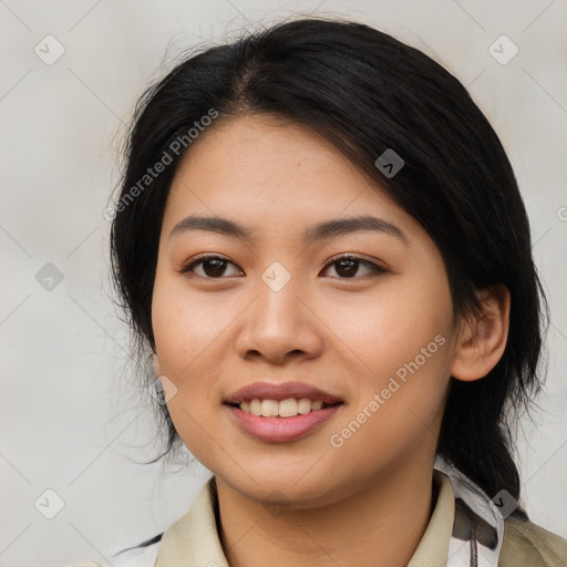 Joyful asian young-adult female with medium  black hair and brown eyes