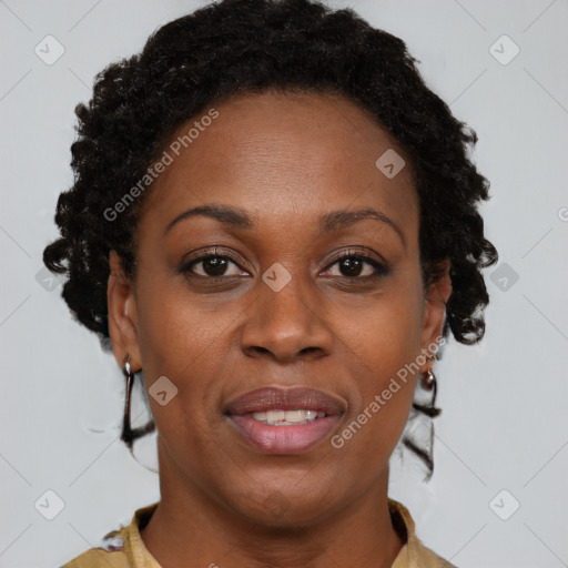 Joyful black adult female with short  brown hair and brown eyes